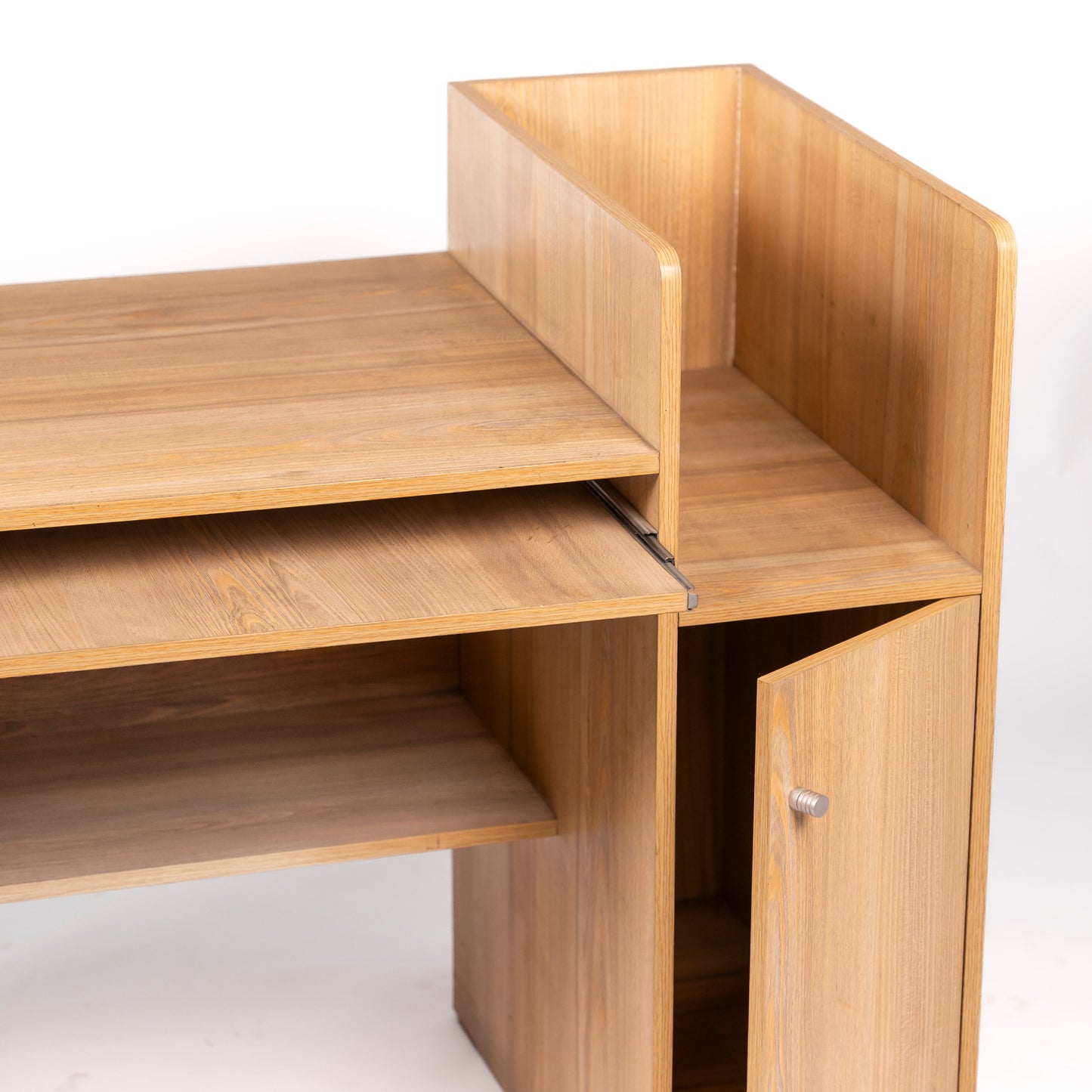 Wooden desk with a clear plastic panel on a white background