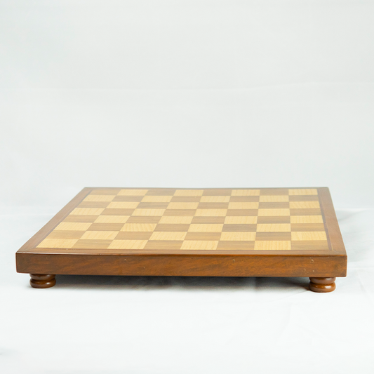 Wooden chessboard with checkered pattern on a white background