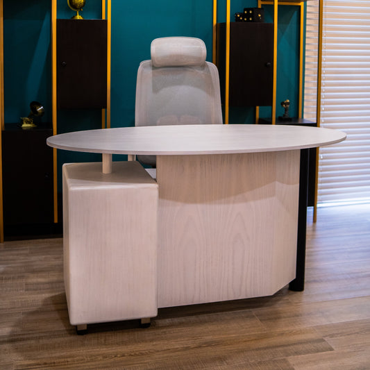 Modern office setup with a desk, chair, and shelves against a teal wall.