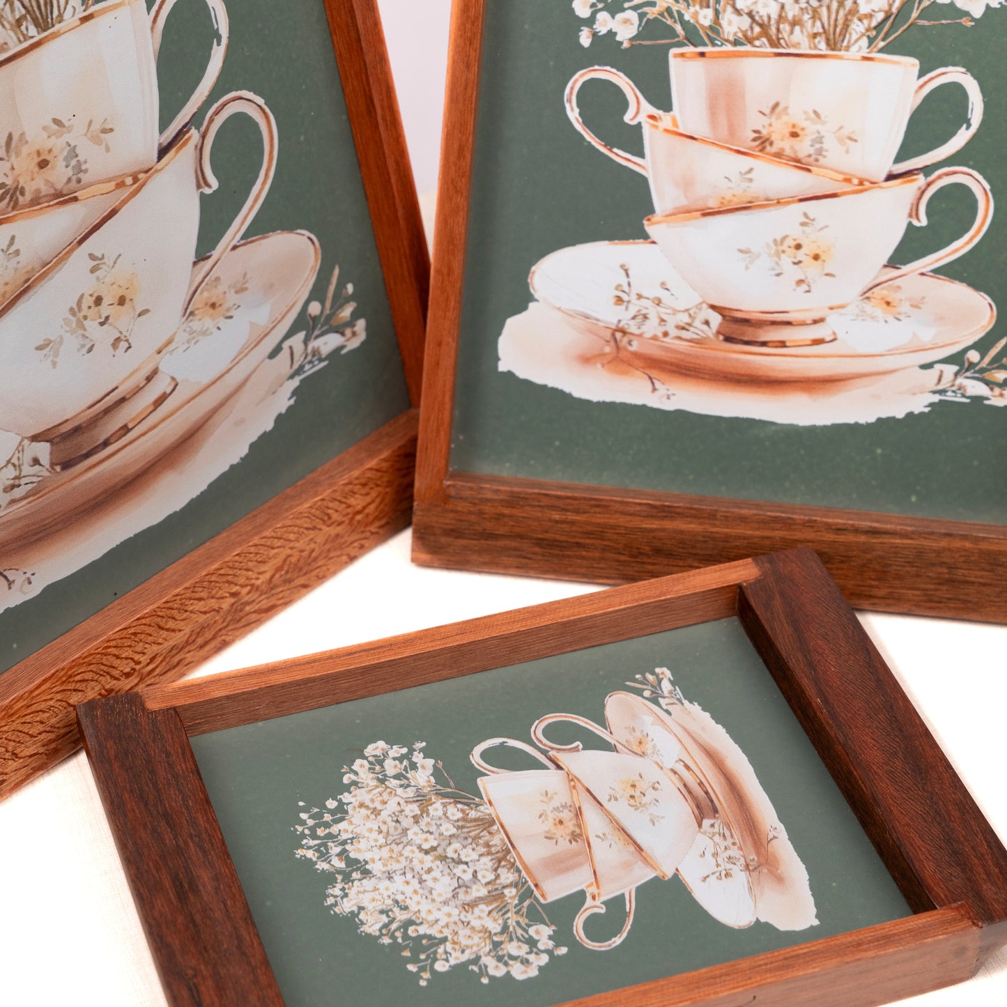 Framed artwork of teacups and flowers on a green background on Tray Set
