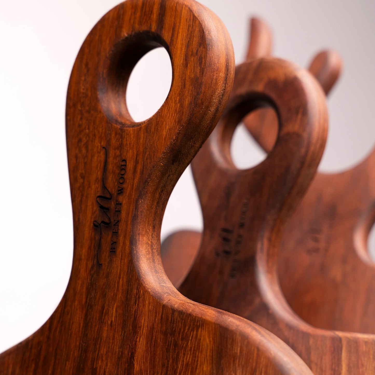 Wooden cutting boards with handles on a white background