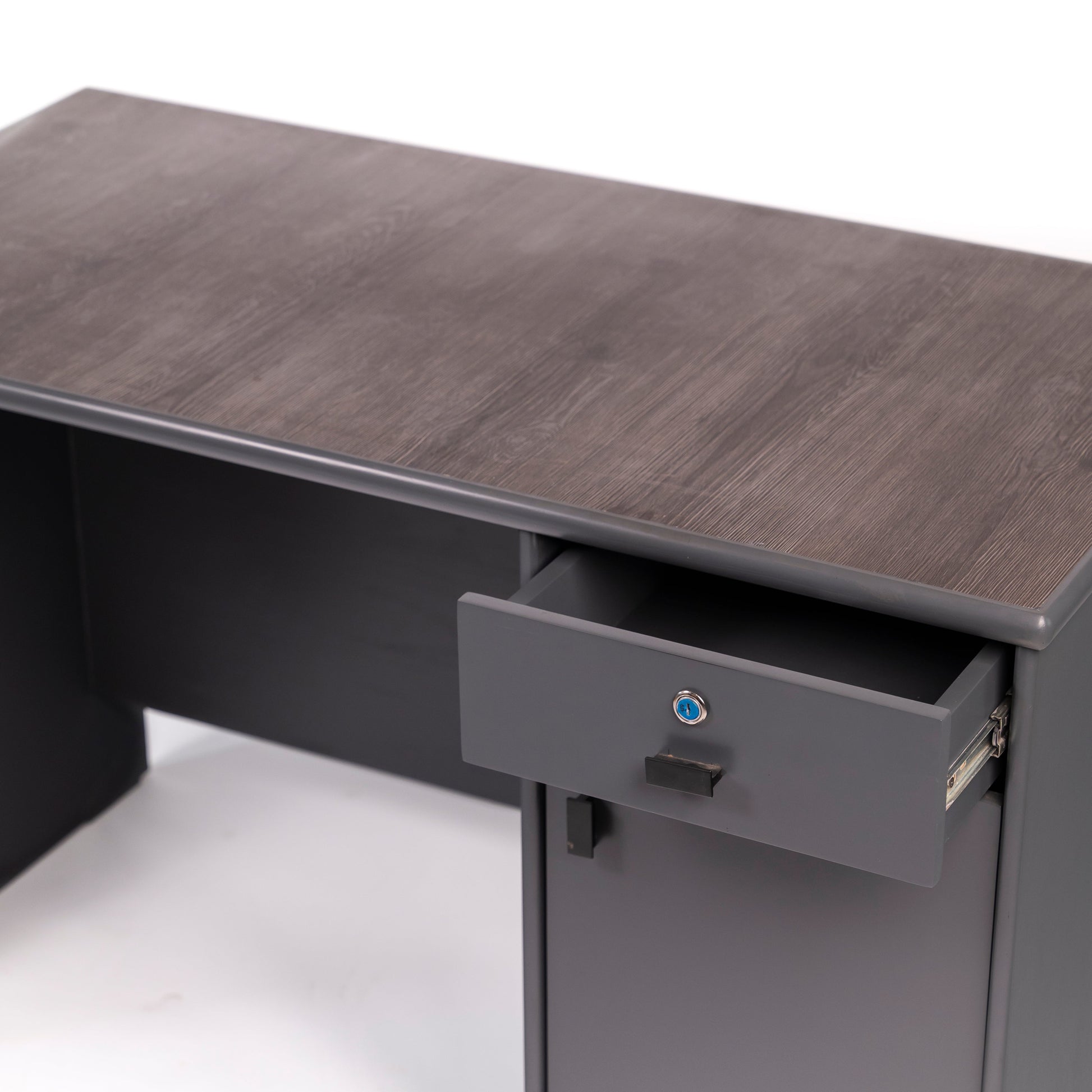 Gray office desk with a drawer open on a white background