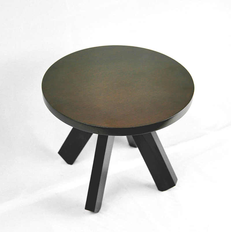 Round wooden table with four legs on a white background