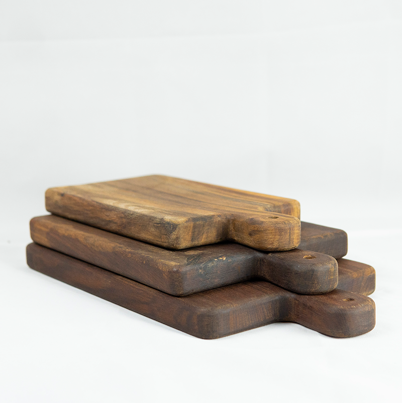 Set of three wooden cutting boards on a white background