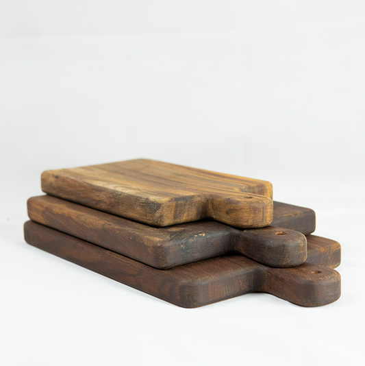 Set of three wooden cutting boards on a white background