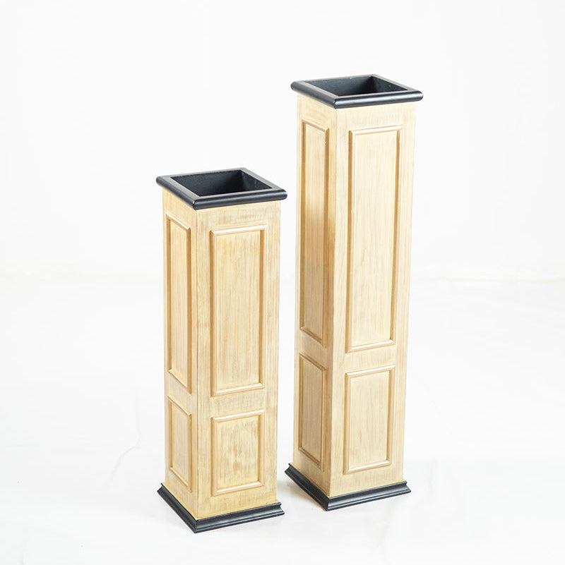 Two wooden Planters with black bases on a white background